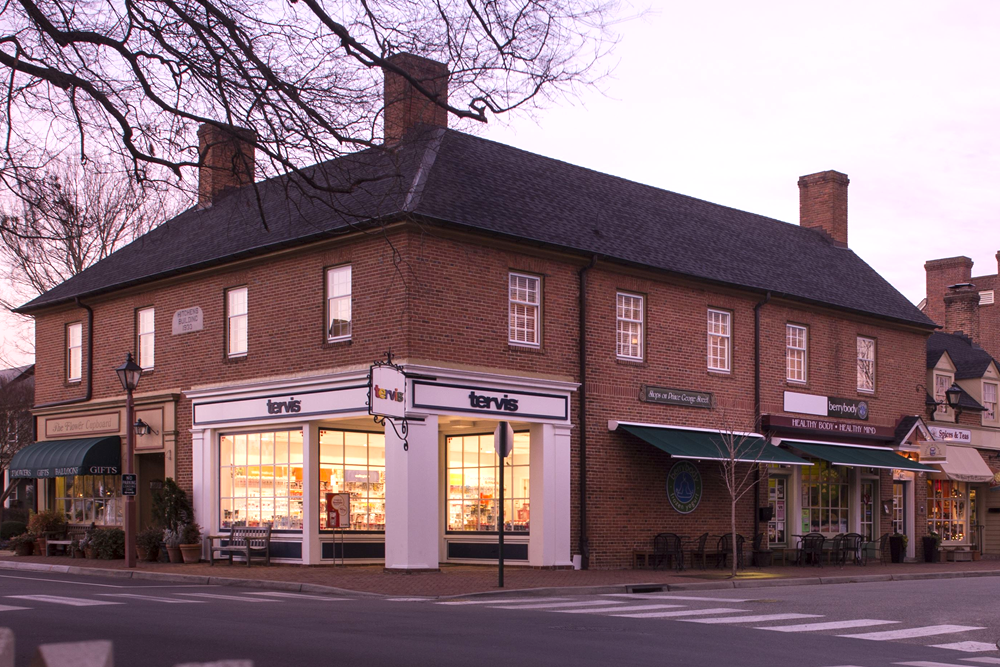 Exterior of fife and drum inn, red brick with white wood accents, two story building