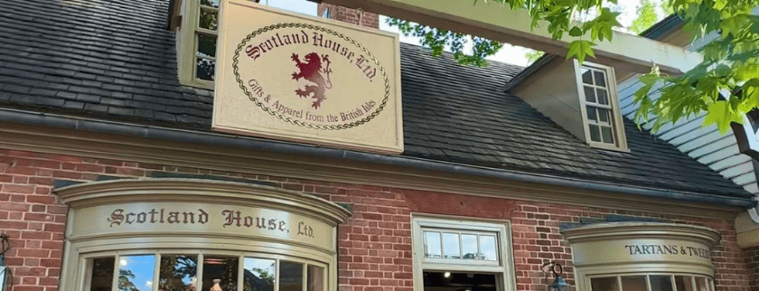 Exterior of Scotland House with a sign reading "Symland House Ltd" featuring a lion emblem.