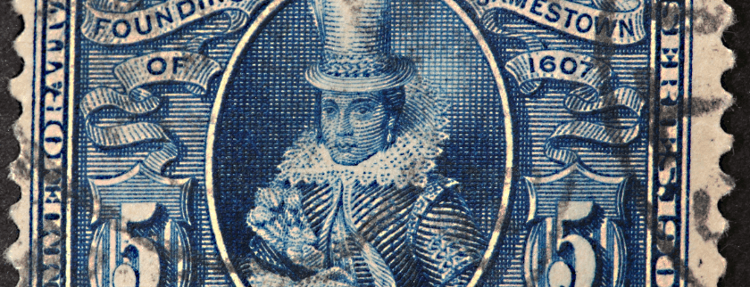 A blue vintage postage stamp featuring a portrait of a regal figure in a tall hat and ruffled collar.