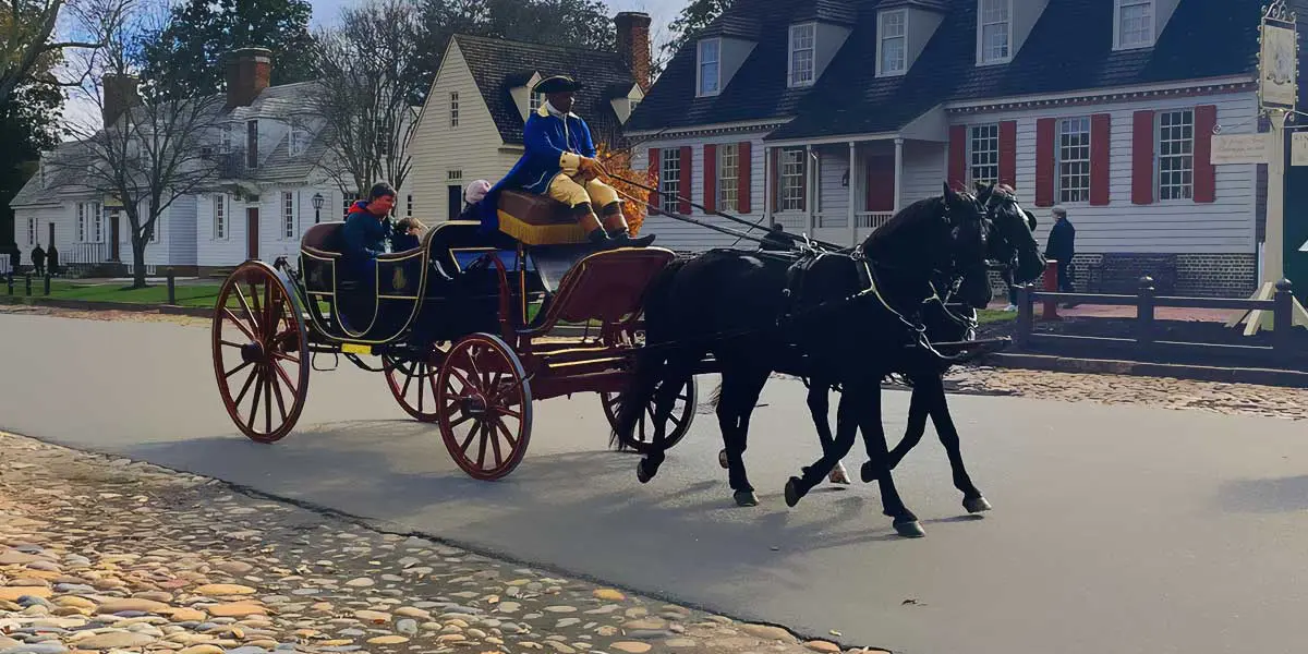 A horse-drawn carriage carries passengers down a historic street lined with colonial-style buildings.
